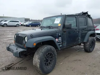 2008 Jeep Wrangler Unlimited X with VIN 1J4GA39138L641138, listed as a IAAI auction lot 41986230 with 215,026 mi miles. Bid and sale history available at carsss.com. Image 18.