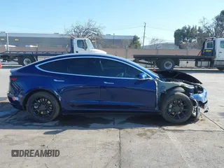 2018 Tesla Model 3 Long Range Battery with VIN 5YJ3E1EA4JF011799, listed as a IAAI auction lot 41765860 with 133,098 mi miles. Bid and sale history available at carsss.com. Image 13.