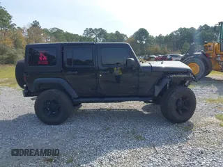 2012 Jeep Wrangler Unlimited Sport with VIN 1C4BJWDG2CL258264, listed as a IAAI auction lot 41880235 with 173,661 mi miles. Bid and sale history available at carsss.com. Image 14.