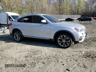 2017 BMW X4 xDrive28i with VIN 5UXXW3C52H0T77719, listed as a Copart auction lot 52393155 with 184,664 mi miles and Salvage title. Bid and sale history available at DreamBid. Image 11.
