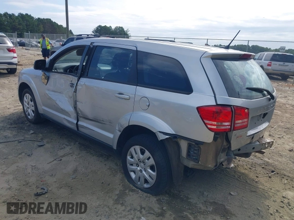 2014 Dodge Journey SE with VIN 3C4PDCAB7ET268221, listed as a IAAI auction lot 40262445 with 153,490 mi miles and . Bid and sale history available at carsss.com. Image 3.