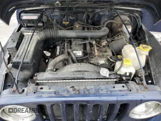 1997 Jeep Wrangler Sport z VIN 1J4FY19S9VP490590, wystawiony jako Copart lot #57492775 z przebiegiem 161 648 mil mil oraz Szkoda całkowita • Salvage title. Historia ofert i sprzedaży dostępna na DreamBid. Obrazek 12.