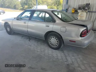 1998 Oldsmobile 88 LS z VIN 1G3HN52K4W4803377, wystawiony jako Copart lot #75638114 z przebiegiem 75 754 mil mil oraz Tytuł czysty. Historia ofert i sprzedaży dostępna na DreamBid. Obrazek 2.