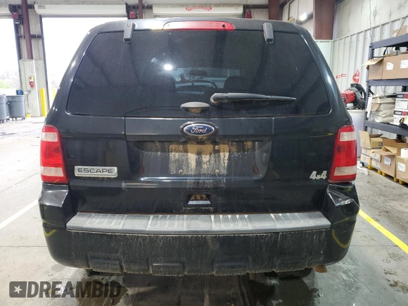 2011 Ford Escape XLS z VIN 1FMCU9C77BKC43662, wystawiony jako Copart lot #51779335 z przebiegiem 104 548 mil mil oraz Szkoda całkowita • Salvage title. Historia ofert i sprzedaży dostępna na DreamBid. Obrazek 6.