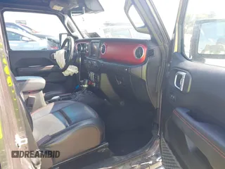 2021 Jeep Wrangler Unlimited Rubicon with VIN 1C4HJXFN5MW509483, listed as a IAAI auction lot 42245703 with 59,461 mi miles and . Bid and sale history available at DreamBid. Image 5.