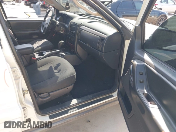 2003 Jeep Grand Cherokee Laredo with VIN 1J4GX48S43C518584, listed as a IAAI auction lot 42213094 with 163,743 mi miles and . Bid and sale history available at DreamBid. Image 5.