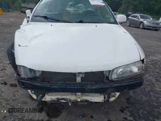 1999 Mitsubishi Mirage z VIN JA3AY36C2XU019134, wystawiony jako IAAI lot #42077649 z przebiegiem 304 426 mil mil oraz . Historia ofert i sprzedaży dostępna na DreamBid. Obrazek 13.