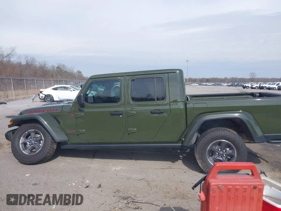 2023 Jeep Gladiator Rubicon with VIN 1C6JJTBGXPL586154, listed as a IAAI auction lot 41370352 with 11,207 mi miles and . Bid and sale history available at DreamBid. Image 14.
