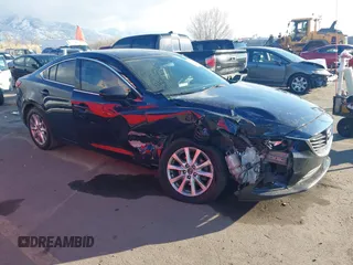 2016 Mazda Mazda6 i Sport with VIN JM1GJ1U54G1403118, listed as a IAAI auction lot 41330515 with 106,788 mi miles. Bid and sale history available at carsss.com. Image 1.