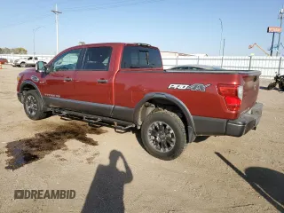 2016 Nissan Titan XD PRO-4X with VIN 1N6BA1F43GN512559, listed as a Copart auction lot 82991154 with 0 mi miles and Salvage Title. Bid and sale history available at carsss.com. Image 2.