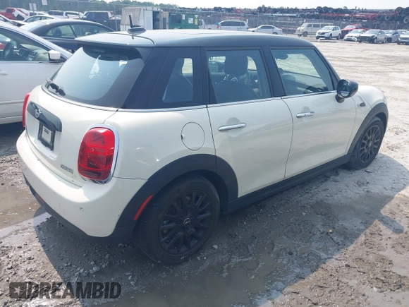 2020 MINI Hardtop 4 Door Cooper with VIN WMWXU7C01L2M54710, listed as a IAAI auction lot 42385956 with 55,714 mi miles and . Bid and sale history available at DreamBid. Image 4.