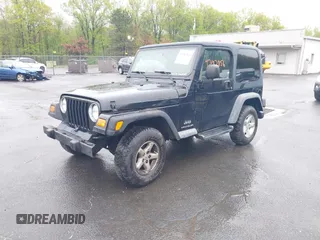 2004 Jeep Wrangler X with VIN 1J4FA39S94P707411, listed as a IAAI auction lot 42187856 with 189,519 mi miles. Bid and sale history available at carsss.com. Image 17.
