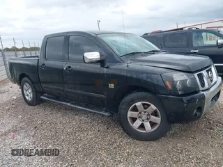 2004 Nissan Titan LE with VIN 1N6AA07A24N512509, listed as a IAAI auction lot 41075523 with 270,302 mi miles. Bid and sale history available at carsss.com. Image 1.