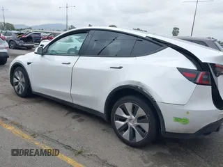 2023 Tesla Model Y Long Range with VIN 7SAYGAEE9PF702910, listed as a IAAI auction lot 42199519 with 91,094 mi miles and . Bid and sale history available at DreamBid. Image 14.