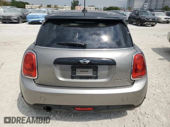 2018 MINI Hardtop Cooper with VIN WMWXP5C56J2H29012, listed as a Copart auction lot 50571595 with 77,129 mi miles and Salvage title. Bid and sale history available at DreamBid. Image 6.