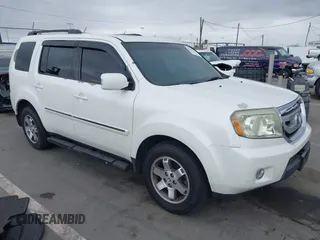 2011 Honda Pilot Touring z VIN 5FNYF3H99BB021049, wystawiony jako IAAI lot #42203521 z przebiegiem 203 087 mil mil oraz . Historia ofert i sprzedaży dostępna na DreamBid. Obrazek 1.