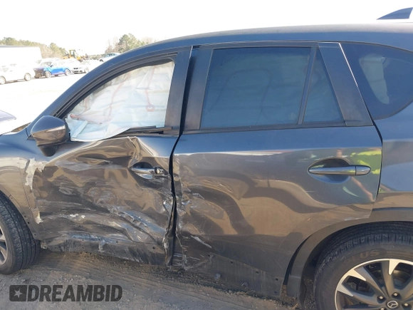2016 Mazda CX-5 Grand Touring with VIN JM3KE4DY8G0823567, listed as a IAAI auction lot 41784384 with 143,836 mi miles and . Bid and sale history available at carsss.com. Image 14.