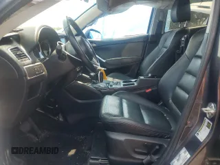 2016 Mazda CX-5 Grand Touring z VIN JM3KE4DY5G0741800, wystawiony jako Copart lot #58565455 z przebiegiem 33 675 mil mil oraz Szkoda całkowita • Salvage title. Historia ofert i sprzedaży dostępna na DreamBid. Obrazek 7.