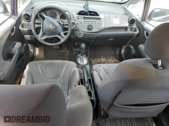 2009 Honda Fit with VIN JHMGE882X9S007865, listed as a Copart auction lot 61025875 with 159,919 mi miles and Clean title. Bid and sale history available at DreamBid. Image 8.