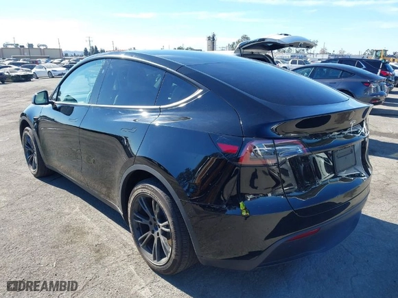 2024 Tesla Model Y with VIN 7SAYGDED6RF152657, listed as a IAAI auction lot 41265862 with NaN miles. Bid and sale history available at carsss.com. Image 3.