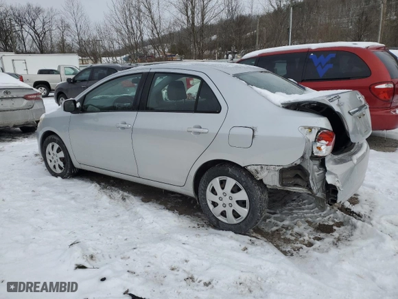 2011 Toyota Yaris with VIN JTDBT4K37B1401590, listed as a Copart auction lot 46142555 with 165,082 mi miles and Salvage Title. Bid and sale history available at carsss.com. Image 2.