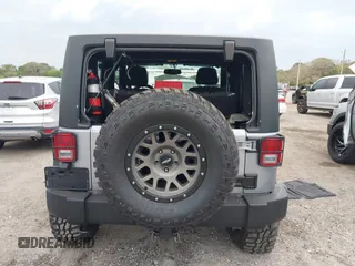 2014 Jeep Wrangler Sport with VIN 1C4AJWAG0EL265409, listed as a IAAI auction lot 41726935 with 78,547 mi miles and . Bid and sale history available at DreamBid. Image 17.