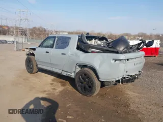 2025 Rivian R1T Adventure z VIN 7FCTGBAAXSN035740, wystawiony jako IAAI lot #41728515 z przebiegiem 3 773 mil mil oraz . Historia ofert i sprzedaży dostępna na DreamBid. Obrazek 3.