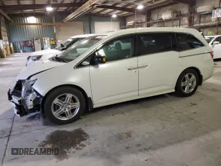 2012 Honda Odyssey Touring with VIN 5FNRL5H96CB091814, listed as a Copart auction lot 51486935 with 242,833 mi miles and Salvage Title. Bid and sale history available at carsss.com. Image 1.