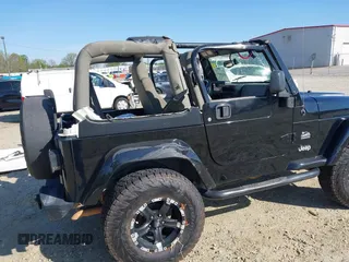 2004 Jeep Wrangler Sahara with VIN 1J4FA59S74P801296, listed as a IAAI auction lot 42049291 with 152,208 mi miles and . Bid and sale history available at DreamBid. Image 6.