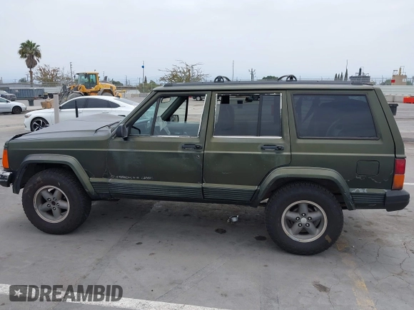 1996 Jeep Cherokee Sport z VIN 1J4FT68S6TL267408, wystawiony jako IAAI lot #42385629 z przebiegiem 268 753 mil mil oraz . Historia ofert i sprzedaży dostępna na DreamBid. Obrazek 14.