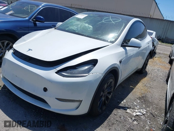 2022 Tesla Model Y Long Range with VIN 7SAYGDEE8NF480939, listed as a IAAI auction lot 41808863 with 62,607 mi miles and . Bid and sale history available at carsss.com. Image 25.