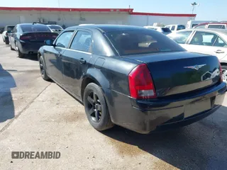 2005 Chrysler 300 with VIN 2C3JA43R65H668010, listed as a IAAI auction lot 41976405 with 216,099 mi miles. Bid and sale history available at carsss.com. Image 3.