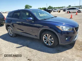 2014 Mazda CX-5 Touring with VIN JM3KE2CY7E0362879, listed as a Copart auction lot 53079545 with 70,863 mi miles and Salvage Title. Bid and sale history available at carsss.com. Image 4.