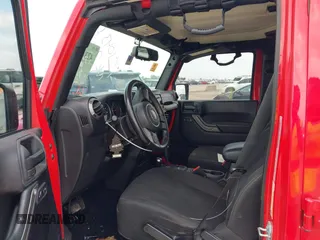 2015 Jeep Wrangler Unlimited Sport with VIN 1C4HJWDGXFL575918, listed as a IAAI auction lot 42349494 with Not provided miles and . Bid and sale history available at DreamBid. Image 5.