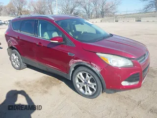 2014 Ford Escape Titanium with VIN 1FMCU9J98EUC24857, listed as a IAAI auction lot 41973037 with 160,634 mi miles. Bid and sale history available at carsss.com. Image 1.