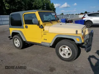 2000 Jeep Wrangler Sport with VIN 1J4FA49SXYP745676, listed as a Copart auction lot 63096755 with 147,226 mi miles and Salvage title. Bid and sale history available at DreamBid. Image 4.