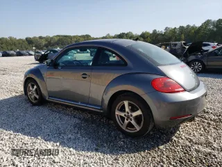 2014 Volkswagen Beetle 2.5L w/Sun with VIN 3VWJP7AT4EM612608, listed as a Copart auction lot 74679104 with 141,559 mi miles and Salvage Title. Bid and sale history available at DreamBid. Image 2.