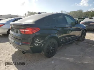 2017 BMW X4 M40i with VIN 5UXXW7C51H0U25766, listed as a Copart auction lot 77749324 with 101,289 mi miles and Salvage Title. Bid and sale history available at carsss.com. Image 3.