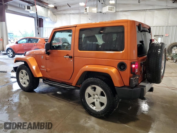 2011 Jeep Wrangler Sahara with VIN 1J4GA5D1XBL557392, listed as a Copart auction lot 56892835 with 109,567 mi miles and Clean title. Bid and sale history available at DreamBid. Image 2.