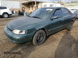 2000 Chevrolet Prizm z VIN 1Y1SK5288YZ400555, wystawiony jako Copart lot #74744874 z przebiegiem 139 695 mil mil oraz Szkody całkowita. Historia ofert i sprzedaży dostępna na DreamBid. Obrazek 1.