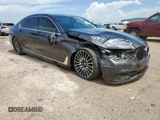 2016 BMW 7 Series 740i with VIN WBA7E2C57GG714564, listed as a Copart auction lot 64005965 with 111,598 mi miles and Salvage title. Bid and sale history available at DreamBid. Image 4.