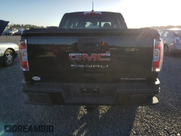 2021 GMC Canyon 2WD Denali with VIN 1GTG5EEN2M1107052, listed as a Copart auction lot 76377704 with 11,696 mi miles and Salvage Title. Bid and sale history available at carsss.com. Image 6.