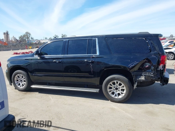2019 Chevrolet Suburban LT with VIN 1GNSCJKCXKR332739, listed as a IAAI auction lot 41636530 with 104,997 mi miles and . Bid and sale history available at DreamBid. Image 14.