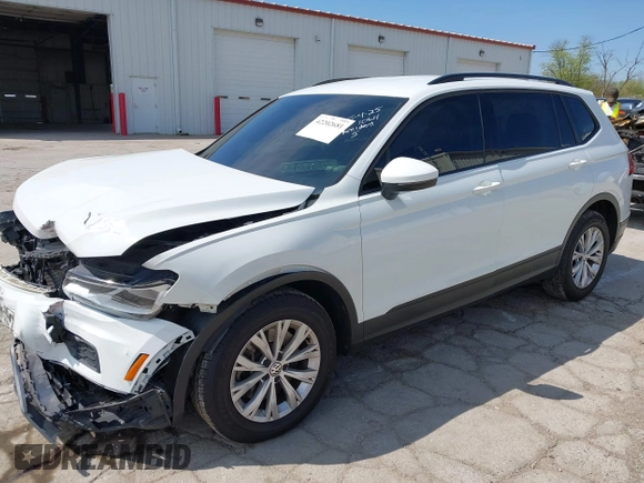 2019 Volkswagen Tiguan S with VIN 3VV0B7AX0KM027036, listed as a IAAI auction lot 42202681 with 75,192 mi miles and . Bid and sale history available at DreamBid. Image 2.