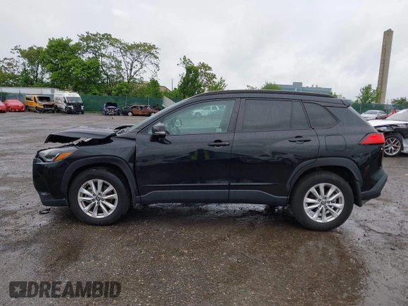 2022 Toyota Corolla Cross LE with VIN 7MUCAABG8NV004527, listed as a IAAI auction lot 42259519 with 15,211 mi miles and . Bid and sale history available at DreamBid. Image 13.