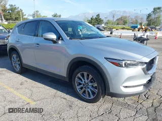 2021 Mazda CX-5 Grand Touring with VIN JM3KFADM1M1393251, listed as a IAAI auction lot 42072862 with 47,758 mi miles. Bid and sale history available at carsss.com. Image 1.