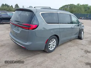 2022 Chrysler Pacifica Touring L with VIN 2C4RC1BG9NR142830, listed as a IAAI auction lot 42412136 with 104,964 mi miles and . Bid and sale history available at DreamBid. Image 4.