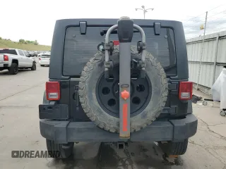 2013 Jeep Wrangler Unlimited Sport with VIN 1C4BJWDG0DL560265, listed as a Copart auction lot 58444045 with 111,354 mi miles and Salvage title. Bid and sale history available at DreamBid. Image 6.