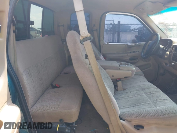 1998 Ford F-150 with VIN 1FTRX18L2WKA67414, listed as a IAAI auction lot 42583873 with 189,546 mi miles and . Bid and sale history available at DreamBid. Image 8.