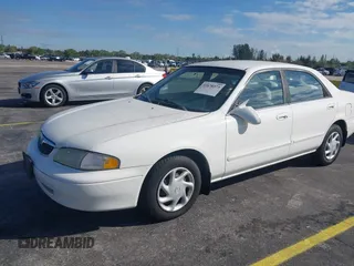 1999 Mazda 626 ES with VIN 1YVGF22C4X5841892, listed as a IAAI auction lot 41678373 with 66,981 mi miles. Bid and sale history available at carsss.com. Image 2.